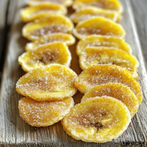 - 3 ripe bananas - 1 tablespoon ground cinnamon - 2 tablespoons brown sugar (or coconut sugar) - 1 teaspoon fresh lemon juice - A pinch of salt - Tips for selecting ripe bananas: Choose bananas that are yellow with a few brown spots. This means they are sweet and ready to use. Avoid bananas that are too green, as they won’t taste as good when cooked. - Alternatives for sugar: If you want a healthier option, use coconut sugar instead of brown sugar. It has a lower glycemic index and adds a unique taste. You can also try honey or maple syrup if you prefer liquid sweeteners. To make the banana chips, start by preparing the bananas. Peel 3 ripe bananas and slice them thinly into rounds. Aim for about 1/8 inch thickness. This thickness helps the chips crisp up nicely. A sharp knife or a mandoline slicer works best for even slices. Consistent thickness allows for even cooking, so take your time with this step. Next, add lemon juice to the banana slices. Toss them gently in a large bowl with 1 teaspoon of fresh lemon juice. This step is key because it prevents the bananas from turning brown and adds a nice flavor to the final snack. Now it’s time to cook the banana chips. First, preheat your air fryer to 350°F (175°C). Allow it to preheat for about 3-5 minutes. This ensures your chips will cook evenly and get that perfect crunch. Once preheated, arrange the banana slices in a single layer in the air fryer basket. If you find your air fryer is small, work in batches. Overcrowding may lead to uneven cooking. Cook the banana slices for 8-10 minutes. Be sure to gently shake the basket halfway through to help them cook evenly. Keep a close eye on them, as air fryer models can vary, and you don’t want them to burn. After cooking, carefully remove the banana chips from the air fryer. They will be golden and crispy. Allow them to cool on a wire rack. As they cool, they will become even crunchier, enhancing that delightful crunch we all love. For serving, arrange the banana chips on a plate. You can enjoy them as is or pair them with a tasty dip. Displaying them nicely makes them even more appealing. For those who want to explore, check out the Full Recipe for more tips and ideas. To get the best results with your banana chips, follow these air fryer tips: - Ideal Settings: Set your air fryer to 350°F (175°C). This temperature cooks the bananas evenly. - Avoid Burning: Keep a close eye on the chips. Shake the basket halfway through to ensure they cook evenly. If they start to darken too much, reduce the time slightly. You can make your banana chips even more fun with these flavor ideas: - Optional Spices: Try adding nutmeg or a dash of vanilla extract to the cinnamon-sugar mix for a unique twist. - Dipping Sauces: Pair your chips with yogurt, chocolate sauce, or nut butter for a tasty dip. Sometimes, you might face issues while making banana chips. Here are common problems and fixes: - Soggy Chips: If your chips are soft, they might need more time in the fryer. Cook them longer while checking frequently. - Uneven Cooking: If some chips are crisp and others are not, slice your bananas to the same thickness. This helps them cook evenly. {{image_4}} You can get creative with your banana chips! Adding cocoa powder gives them a rich, chocolatey flavor. Just mix in about one tablespoon of cocoa powder with your cinnamon-sugar mix. It adds a fun twist! You can also switch up sweeteners. Instead of brown sugar, try honey, maple syrup, or stevia. Each choice will change the taste slightly, so experiment to find your favorite. If you're looking for healthier options, consider using coconut sugar instead of brown sugar. Coconut sugar has a lower glycemic index. It is a great choice for a sweet treat. You can also try other fruits. Apples or pears work well in this recipe. Slice them thinly and follow the same steps. It’s a fun way to mix up your snacks! To keep your banana chips fresh, place them in an airtight container. This method stops air from making them soft. You can also use a zip-top bag, but make sure to squeeze out all the air. Store the chips in a cool, dry place. Avoid direct sunlight, as it can affect their crunch. These banana chips last about a week when stored properly. If you notice any signs of moisture, discard them. The texture is best when they are fresh, so enjoy them quickly! If your banana chips lose their crunch, don’t worry! You can easily revive them. Preheat your air fryer to 350°F (175°C). Place the chips in the basket in a single layer. Heat them for 2-3 minutes. This quick step brings back their crispy texture. Just be careful not to overheat them, as they can burn quickly. To make banana chips in an air fryer, start with ripe bananas. Peel and slice them thinly, about 1/8 inch thick. Toss the slices with lemon juice to prevent browning. In a bowl, mix cinnamon, brown sugar, and salt. Coat the banana slices with this mixture. Preheat your air fryer to 350°F. Place the slices in a single layer in the basket. Cook for 8-10 minutes, shaking halfway through. Let them cool on a wire rack for extra crunch. Using unripe bananas is not ideal for this recipe. They are harder and less sweet. Ripe bananas have more flavor and sweetness. If you only have unripe bananas, you can try them, but the taste will differ. Banana chips offer several nutritional benefits: - They are a good source of potassium. - They provide fiber, which aids digestion. - They contain vitamins B6 and C, important for your health. - Cinnamon adds antioxidants and may improve blood sugar levels. These benefits make banana chips a tasty and healthy snack. After making cinnamon-sugar air fryer banana chips, they can last up to a week. Store them in an airtight container to keep them fresh. If they lose crunch, you can reheat them in the air fryer for a few minutes. Yes, you can make banana chips without sugar! Use coconut sugar, honey, or maple syrup for sweetness. You can also skip the sweetener and focus on the cinnamon flavor. Adjust to your taste, and enjoy a healthier snack! This guide covered everything you need to make delicious banana chips in an air fryer. We discussed the best ingredients, preparation steps, and cooking tips to ensure perfect snacks. Remember to choose ripe bananas and explore flavor variations to suit your taste. With proper storage, your banana chips will stay fresh. Enjoy your homemade treat, knowing you can satisfy cravings while keeping it simple and healthy. Happy cooking!