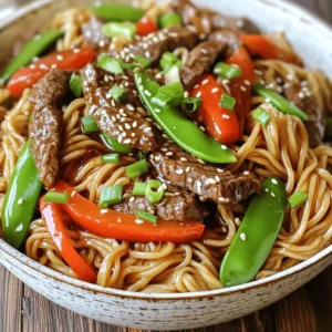 To make sticky beef noodles, gather these key ingredients: - 250g beef sirloin, thinly sliced against the grain - 200g rice noodles - 2 tablespoons soy sauce - 1 tablespoon oyster sauce (optional, for extra depth of flavor) - 1 tablespoon hoisin sauce - 1 tablespoon sesame oil - 2 cloves garlic, finely minced - 1-inch piece fresh ginger, grated - 1 red bell pepper, sliced into thin strips - 1 cup snap peas, trimmed - 2 green onions, chopped diagonally - 1 tablespoon sesame seeds (for garnish) - Salt and freshly ground black pepper to taste Fresh ingredients bring life to sticky beef noodles. Use fresh beef sirloin, vegetables, and ginger. These add flavor and texture. Pantry staples like soy sauce and hoisin sauce give the dish depth. I always keep these sauces on hand. They make cooking quick and easy. Using fresh and pantry ingredients together creates a balanced dish. If you can't find beef sirloin, use flank steak or chicken. For a vegetarian option, substitute beef with tofu. Rice noodles are great, but you can use egg noodles or even zucchini noodles. If you want less sweetness, skip the hoisin sauce. You can replace it with more soy sauce. Feel free to get creative with your ingredients. Each change can give the dish a new twist. For the best results, make sure to follow the Full Recipe for guidance. To make sticky beef noodles, start with the rice noodles. Cook them as the package says. Drain the noodles and set them aside. Next, take a medium bowl. Add the sliced beef, soy sauce, oyster sauce, and hoisin sauce. Mix well and let it marinate for 15 minutes. This helps the beef soak up the flavors. Now, heat a large skillet or wok over medium-high heat. Add sesame oil and let it warm. Carefully place the marinated beef in a single layer in the hot pan. Stir-fry for 2-3 minutes until the beef is browned. Once done, remove the beef and keep it warm on a plate. In the same pan, add minced garlic and grated ginger. Stir quickly for about 30 seconds until they smell great. Now, add sliced red bell pepper and snap peas. Stir-fry for another 2-3 minutes. You want them to stay bright and a bit crisp. Bring back the cooked beef to the skillet with the drained rice noodles. Toss everything gently so the noodles get coated with the sauce. Warm it through for about a minute. Finally, add chopped green onions and stir-fry for one more minute. Taste it and add salt or pepper if you want. Marinating beef is key to great flavor. Use thin slices to help the marinade soak in better. A good marinade has salt, acid, and fat. The soy sauce gives salt and umami. Oyster sauce adds depth. Let the beef sit for at least 15 minutes. For best results, marinate beef for up to 2 hours in the fridge. This helps the flavors to really blend. To get sticky noodles, cook them just right. Follow the package instructions closely. Drain and rinse them under cold water to stop cooking. This keeps them from getting mushy. When adding the noodles into the pan, toss them gently with the beef and veggies. The sauces will coat them nicely. If the noodles seem dry, add a splash of water or more sauce. This will help them stick together and absorb the flavors. For the full recipe, check out the details above! To get the right sauce for your sticky beef noodles, balance is key. Start with your soy sauce, hoisin sauce, and oyster sauce. Mix them well to make sure they blend. If the sauce seems too thin, add a bit more hoisin. If it’s too thick, a splash of water can help. Remember, the sauce should cling to your noodles, not drown them. One common mistake is overcooking the beef. Make sure to stir-fry it for just 2-3 minutes. This keeps the beef tender and juicy. Another mistake is not letting the beef marinate long enough. A quick 15 minutes will help the flavors soak in. Lastly, don’t skip the fresh ginger and garlic. They add a nice kick to your dish. Having the right tools makes cooking easier. A large skillet or wok is best for stir-frying. A good knife helps you cut the beef thinly. A colander is useful for draining your rice noodles. Finally, a sturdy spatula or tongs helps toss everything together. These tools will save you time and make your cooking fun. For the full recipe, check out the Sticky Beef Noodles Delight 🥢. {{image_4}} If you want a meat-free meal, try mushrooms or jackfruit. They soak up flavors well. Tofu is a great option too. Firm tofu can mimic beef’s texture. Use the same marinade for tofu. Just press and cube it before cooking. You can also add more veggies like carrots or zucchini. They will keep your dish vibrant and full of nutrients. You can switch the beef for chicken or pork easily. Thin slices of chicken breast stir-fry quickly. Just adjust cooking time to ensure it cooks through. Pork tenderloin is another great choice. If you prefer plant-based, stick with tofu or tempeh. Both offer protein and can take on the dish's flavors. Add variety with different sauces. Try peanut sauce for a nutty flavor. You could also use teriyaki sauce for a sweeter taste. A dash of chili sauce adds heat if you like spice. Mixing in a splash of rice vinegar gives a tangy twist. Experiment and find your favorite blend! For the full recipe, check out the Sticky Beef Noodles Delight. After enjoying your sticky beef noodles, cool them down. Place leftovers in an airtight container. This keeps the flavors fresh. Store them in the fridge for up to three days. Make sure to separate the meat and noodles if possible. This helps maintain their texture. When you're ready to eat, reheating is key. Use a skillet for the best results. Heat a little oil over medium heat. Add the noodles and beef. Stir gently until warm. This method keeps the dish tasty and avoids sogginess. You can also splash a bit of water to add moisture. Want to freeze your sticky beef noodles? First, cool them completely. Place in a freezer-safe container. They can last up to three months in the freezer. When you're ready to eat, thaw in the fridge overnight. Reheat as mentioned before for the best flavor. This way, you enjoy that delightful taste again! Sticky beef noodles are a savory dish featuring tender beef and rice noodles. The beef is marinated and stir-fried, then tossed with cooked noodles and a mix of sauces. This dish has a rich and slightly sweet flavor, making it a favorite for many. It's quick to make and can be enjoyed any day of the week. To make your sauce thicker, you can add a cornstarch slurry. Mix one tablespoon of cornstarch with two tablespoons of water. Stir this mixture into your sauce as it simmers. This will help the sauce cling to the beef and noodles nicely. Another option is to reduce the sauce longer on low heat. This method intensifies the flavors and thickens the sauce naturally. Yes, you can use different noodles! While rice noodles work great, you can try egg noodles, udon, or even whole wheat noodles. Each type of noodle brings its own texture and taste. Just be sure to cook them according to the package instructions before adding them to your beef and sauce mix. Sticky beef noodles pair well with light dishes. Try a simple cucumber salad to add crunch. You can also serve it with spring rolls for a fun appetizer. A side of steamed broccoli or bok choy adds color and nutrition to the meal. To reheat sticky beef noodles, use a skillet over low heat. Add a splash of water or broth to keep the noodles moist. Stir gently until heated through. You can also use a microwave, covering the dish with a damp paper towel. This keeps the noodles from drying out. Enjoy your meal just as tasty as the first time! For the full recipe, check out Sticky Beef Noodles Delight. Sticky Beef Noodles are a delight. You learned about key ingredients, cooking methods, and tips. With variations for different diets, this dish fits everyone. Storing and reheating it is easy too. Remember, the right sauce and cooking techniques make a big difference. Avoid common mistakes for the best results. Enjoy creating your own version of this tasty recipe!