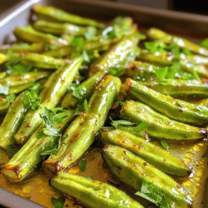 - 1 pound fresh okra, trimmed and halved lengthwise - 2 tablespoons extra-virgin olive oil - 1 teaspoon garlic powder - 1 teaspoon smoked paprika - 1/2 teaspoon cayenne pepper (adjust to your spice preference) - Salt and freshly ground black pepper, to taste Fresh okra is the star of this dish. Choose bright green, firm pods. Olive oil helps the okra crisp up nicely in the oven. Garlic powder and smoked paprika add a rich, savory flavor. Cayenne pepper gives it a kick, so adjust it to your liking. Lastly, salt and pepper enhance all the flavors. - Fresh parsley, finely chopped (for garnish) - 2 tablespoons freshly squeezed lemon juice Adding fresh parsley gives a nice touch of color and freshness. A squeeze of lemon juice right after roasting brightens the flavors and adds a zesty finish. - Yogurt or tahini dip - Pairing with main dishes Serve the roasted okra as a side dish or snack. A creamy yogurt or tahini dip pairs perfectly with it. You can also enjoy it alongside grilled chicken, fish, or rice. For the full recipe, check out the complete details above. Set your oven to 425°F (220°C). This temperature helps the okra crisp up nicely. Using parchment paper is key. It keeps the okra from sticking and makes cleanup easy. First, trim the ends of the okra. Then, slice them in half lengthwise. In a big bowl, add the okra. Pour in 2 tablespoons of extra-virgin olive oil. Sprinkle in 1 teaspoon of garlic powder, 1 teaspoon of smoked paprika, and 1/2 teaspoon of cayenne pepper. Add salt and pepper to taste. Mix well until all the okra is coated. Spread the okra evenly on the baking sheet. Make sure they have space. This helps them roast better. Roast them for about 20-25 minutes. Halfway through, stir or flip the okra. This ensures even cooking. Once they are golden brown, take them out. Drizzle with fresh lemon juice and toss again. Finally, transfer to a serving dish and garnish with chopped parsley. For the full recipe, check the earlier section. To get your okra nice and crispy, don’t overcrowd the pan. If you pack them too tightly, they will steam instead of roast. Spread them out in a single layer on the baking sheet. This allows hot air to flow around each piece. You can also experiment with cooking times. If you like your okra crunchier, try roasting them a bit longer. Just keep an eye on them to avoid burning. Adding spices or herbs can take your roasted okra to the next level. You can mix in cumin, chili powder, or even fresh herbs like thyme or oregano. Adjust the spice levels to fit your taste. If you enjoy heat, add more cayenne. For a milder flavor, cut back on the spice. Tasting as you go helps you find the perfect balance. Serve your roasted okra hot for the best taste. You can place them on the table right out of the oven. If you prepare them in advance, reheat them in the oven at 350°F (175°C) for about 10 minutes. This keeps them crispy. Avoid microwaving, as it can make them soggy. Enjoy your tasty side dish right away for maximum flavor! {{image_4}} You can make your roasted okra even more exciting. Try adding other vegetables like bell peppers, zucchini, or cherry tomatoes. These veggies roast well and add color to your dish. They also bring new flavors that blend nicely with okra. You can switch up the oil too. Instead of olive oil, use avocado oil for a buttery taste. You might even try sesame oil for a nutty twist. Also, consider using different vinegars. A splash of balsamic vinegar can add a sweet note, while apple cider vinegar can give a tangy kick. This roasted okra recipe is easy to adapt. If you want a vegan option, you’re in luck! The recipe is already vegan-friendly. Just be sure to check your spices for any hidden animal products. If you need gluten-free options, this recipe works perfectly. All the ingredients are naturally gluten-free. Just make sure to double-check any spice blends you use. You can put a fun spin on roasted okra with regional flavors. For a Southern-style dish, add cornmeal to your spice mix. This gives the okra a crunchy coating that pairs great with fried chicken. For a Mediterranean vibe, sprinkle some feta cheese over the okra right after roasting. You can also add herbs like oregano or thyme for extra flavor. These twists make your roasted okra unique and exciting! Want to try the full recipe? Check out the Full Recipe for detailed steps! After cooking, let your okra cool down. Place leftovers in an airtight container. This keeps your okra fresh and tasty. You can store it in the fridge for up to three days. Use glass or BPA-free plastic containers for best results. Yes, you can freeze roasted okra! To do this, let it cool completely before packing. Use a heavy-duty freezer bag or airtight container. Remove as much air as you can before sealing. When you want to eat it, thaw it overnight in the fridge. Reheat in the oven for a crispy finish. Roasted okra lasts about three to four days in the fridge. If frozen, it can last for up to six months. Check for any off smells or slimy texture. If you see these signs, it’s best to throw it away. Enjoy your okra while it’s fresh for the best taste! The best temperature for roasting okra is 425°F (220°C). This high heat helps the okra get crispy. At this temperature, the okra cooks evenly and develops a nice golden color. Always preheat your oven to ensure even cooking. You can use frozen okra, but there are a few things to keep in mind. Frozen okra often has more moisture, which can lead to sogginess. If you use frozen, consider draining and patting them dry before cooking. This helps reduce extra moisture and keeps them crispy. To make okra less slimy, try these tips: - Trim and cut the okra just before cooking. - Soak the okra in vinegar for about 30 minutes. - Roast at a high temperature with oil and spices. These methods help minimize the natural texture that some people find unappealing. Enjoy your Easy Roasted Okra as a tasty side dish with these tips! For the full recipe, check out the details above. Roasting okra is simple and rewarding. You start with fresh ingredients like olive oil and spices. Follow the step-by-step guide to get that perfect crispness. Remember to use parchment paper for easy cleanup. Explore variations, add your favorite veggies, or adjust for dietary needs. Store leftovers wisely to keep them fresh. Enjoy experimenting with flavors and serving it with dips or main dishes. This versatile veggie can be the star of your meals. Try roasting okra today for a tasty twist!