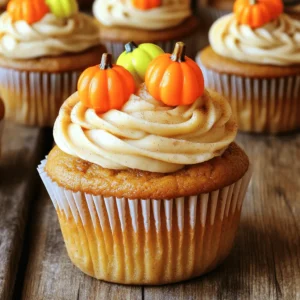 - 1 ¾ cups all-purpose flour - 1 teaspoon baking powder - 1 teaspoon baking soda - 1 teaspoon ground cinnamon - ½ teaspoon ground nutmeg - ½ teaspoon ground ginger - ¼ teaspoon salt - 1 cup granulated sugar - ½ cup packed brown sugar The dry ingredients form the base for our pumpkin cupcakes. The flour gives structure. The baking powder and baking soda help them rise. The spices add warmth and flavor. Each ingredient plays a part in making your cupcakes delicious. - ½ cup vegetable oil - 2 large eggs - 1 cup canned pumpkin puree - 1 teaspoon vanilla extract - ½ cup buttermilk In this section, we mix the wet ingredients. The vegetable oil keeps the cupcakes moist. Eggs bind everything together. Pumpkin puree adds flavor and a beautiful orange hue. Vanilla extract gives a lovely aroma, while buttermilk makes them fluffy and tender. - 8 oz cream cheese, softened - ½ cup unsalted butter, softened - 2 cups powdered sugar - 1 teaspoon vanilla extract - 1 teaspoon ground cinnamon The frosting is the star of this recipe. Cream cheese and butter create a smooth base. Powdered sugar sweetens it just right. Vanilla and cinnamon add extra flavor. This frosting pairs perfectly with the spicy pumpkin cupcakes. For the full recipe, check out Pumpkin Magic Cupcakes . First, preheat your oven to 350°F (175°C). This step is key for even baking. Next, line your 12-cup muffin tin with cupcake liners. This makes it easy to take the cupcakes out later. In a medium bowl, whisk together the dry ingredients. Combine 1 ¾ cups of all-purpose flour, 1 teaspoon of baking powder, 1 teaspoon of baking soda, 1 teaspoon of ground cinnamon, ½ teaspoon of ground nutmeg, ½ teaspoon of ground ginger, and ¼ teaspoon of salt. Mixing these spices brings out rich flavors in your cupcakes. In another large bowl, mix the sugars and oil. Use 1 cup of granulated sugar, ½ cup of packed brown sugar, and ½ cup of vegetable oil. Beat these ingredients together until smooth. This adds sweetness and moisture to your batter. Now, add the eggs to your sugar mix. Use 2 large eggs, adding one at a time. Beat well after each addition. Next, mix in 1 cup of canned pumpkin puree and 1 teaspoon of vanilla extract. This combination gives your cupcakes a soft texture and a warm flavor. Gradually mix the dry ingredients into the wet mix. Use a spatula to fold gently. Add ½ cup of buttermilk while mixing to keep the batter moist. Be careful not to overmix; you want your cupcakes to stay fluffy and light. Fill each cupcake liner about two-thirds full with batter. This allows space for rising. Place the muffin tin in your preheated oven and bake for 18-20 minutes. To test if they are done, insert a toothpick into the center. It should come out clean. While the cupcakes cool, prepare the frosting. In a medium bowl, beat together 8 oz of softened cream cheese and ½ cup of softened unsalted butter until smooth. Gradually add 2 cups of powdered sugar. Mix until well combined, then add 1 teaspoon of vanilla extract and 1 teaspoon of ground cinnamon. Beat until your frosting is light and fluffy. Once the cupcakes cool completely, it’s time to frost. Use a piping bag for a fancy touch or a spatula for a simple look. Generously apply the cinnamon cream cheese frosting on each cupcake. You can add a sprinkle of cinnamon or a cute candy pumpkin for decoration. For a complete guide, check out the Full Recipe. To make your pumpkin cupcakes fluffy, start with room temperature ingredients. This helps them mix better. Use a light hand when mixing the batter. Overmixing can lead to dense cupcakes. I recommend folding the dry ingredients into the wet ones gently. This keeps air in the batter. Also, be sure to check your baking powder and baking soda. Fresh leavening agents give the best rise. For a smooth frosting, make sure your cream cheese and butter are at room temperature. This helps them blend easily. Use a hand mixer to whip them until creamy. Gradually add the powdered sugar. This prevents a sugar cloud and helps achieve a smooth texture. Once combined, add vanilla and cinnamon, mixing until fluffy. Frost your cupcakes only after they have cooled completely. This keeps the frosting from melting. Get creative with your cupcake decorations! A simple sprinkle of cinnamon on top adds warmth. You can also use candy pumpkins for a fun touch. If you want something fancy, try piping the frosting in swirls. A star tip works great for this. You could even add crushed nuts or chocolate shavings for extra flair. For a seasonal feel, consider using edible leaves or fall-themed sprinkles. These ideas will make your pumpkin cupcakes shine! For the complete recipe, check out the Full Recipe section. {{image_4}} You can enjoy these pumpkin cupcakes without gluten. To make a gluten-free version, use 1 ¾ cups of gluten-free all-purpose flour. Check that your flour blend includes xanthan gum. This helps the cupcakes rise and stay fluffy. Follow the same steps in the full recipe for mixing and baking. For a vegan twist, swap out the eggs and buttermilk. Use 1 tablespoon of ground flaxseed mixed with 2.5 tablespoons of water for each egg. Let it sit for 5 minutes to thicken. Instead of buttermilk, use 1 cup of almond milk mixed with 1 tablespoon of lemon juice. This will give your cupcakes a nice texture. Use the full recipe to guide your process. If cream cheese isn't your favorite, try these frostings. A simple vanilla buttercream is easy to make. Just mix ½ cup of softened butter with 2 cups of powdered sugar and 1 teaspoon of vanilla extract. For a chocolate twist, add ¼ cup of cocoa powder. You can also try a coconut whipped cream. Just whip 1 can of chilled coconut cream with 2 tablespoons of powdered sugar. Store your pumpkin cupcakes in an airtight container. This helps keep them fresh. Place them at room temperature for short-term storage. If you expect to eat them within a few days, this works well. For longer storage, refrigerate them. The cool air helps maintain their flavor and moisture. You can freeze these cupcakes if you want to save some for later. First, let them cool completely. Wrap each cupcake in plastic wrap tightly. Then, place them in a freezer bag or container. This will protect them from freezer burn. They will stay fresh for up to three months. When you're ready to eat, let them thaw in the fridge overnight. Freshly baked pumpkin cupcakes last about four to five days at room temperature. In the fridge, they can last up to a week. With proper freezing, they can last for three months. Always check for any signs of spoilage before enjoying. The flavors will still be great, but freshness is key for the best taste. For the full recipe, refer to the earlier section. You can use plain yogurt or milk with vinegar. Mix one cup of milk with one tablespoon of vinegar. Let it sit for five minutes. This will give you a nice tang similar to buttermilk. Bake the cupcakes for 18 to 20 minutes. The perfect time makes them fluffy and moist. Yes, you can prepare the batter a day ahead. Just store it in the fridge. Bake the cupcakes fresh before serving for the best taste. Insert a toothpick into a cupcake. If it comes out clean, they are ready. If not, bake for a few more minutes. Absolutely! You can add allspice, clove, or even cardamom. These spices will enhance the flavor of your cupcakes. Use a piping bag for a beautiful design. If you don’t have one, a spatula works great too. Apply the frosting once the cupcakes are cool. For a fun touch, add a sprinkle of cinnamon on top. Check out the Full Recipe for more tips! You learned about making delicious pumpkin cupcakes. We talked about ingredients, steps, and helpful tips. I shared ways to store and freeze them too. Remember, fluffy cupcakes need care in mixing. You can also try gluten-free and vegan options for fun. Your baking journey can be simple and rewarding. Enjoy these cupcakes with friends or keep them all to yourself! Happy baking!