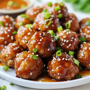 For the base of the teriyaki meatballs, you can use different types of ground meat. My favorite is ground chicken. It stays juicy and has a mild flavor. You can also use ground turkey if you want a leaner option. Ground beef offers a richer taste but may be a bit heavier. Choose what you enjoy most. To create that delightful taste, gather these ingredients: - 1 lb ground chicken - 1/2 cup breadcrumbs - 1/4 cup green onions, finely chopped - 1 clove garlic, minced - 1 tsp grated ginger - 1 large egg - 1/4 cup soy sauce (low sodium) - 2 tbsp honey - 2 tbsp rice vinegar - 1 tbsp sesame oil - 1 tbsp cornstarch mixed with 2 tbsp water (for thickening) These ingredients combine to give the meatballs their unique flavor. The garlic and ginger add a warm kick, while the honey and soy sauce balance the taste with sweetness and saltiness. Presentation matters, even with meatballs! For garnishing, use: - Sesame seeds - Additional green onions Sprinkle these on top right before serving. The sesame seeds add a nice crunch, and the green onions give a fresh touch. It's a simple way to make your dish look gourmet! {{ingredient_image_1}} First, preheat your oven to 400°F (200°C). This step ensures that the meatballs cook evenly. While the oven heats up, line a baking sheet with parchment paper. This makes for easy cleanup later. In a large bowl, combine the ground chicken, breadcrumbs, chopped green onions, minced garlic, and grated ginger. Add one egg and one tablespoon of soy sauce to the mix. Use your hands to blend everything together. Make sure it is mixed well. The mixture should feel sticky but not too wet. Now, form the mixture into meatballs, each about one inch in diameter. Place them carefully on your prepared baking sheet. Bake the meatballs for 20-25 minutes. Flip them halfway through to ensure they cook evenly. They should be golden brown and cooked through when done. While the meatballs bake, it’s time to make the teriyaki sauce. In a saucepan, mix the remaining soy sauce, honey, rice vinegar, and sesame oil. Heat this over medium heat. Stir gently until the honey completely dissolves. This will create a rich and sweet sauce. To thicken the sauce, mix cornstarch with water in a small bowl. Gradually add this mix to the saucepan, stirring as you go. Once the sauce thickens, remove it from the heat. When the meatballs are ready, transfer them to a large bowl and pour the teriyaki sauce over them. Toss everything gently to coat each meatball. Finally, serve your sticky teriyaki meatballs on a platter. Garnish with sesame seeds and extra green onions for a fresh touch. To get the best texture, use ground chicken. It keeps meatballs moist. Adding breadcrumbs helps bind the meat. Be sure to mix gently. Overmixing makes meatballs tough. Form them into balls about one inch wide. This size cooks evenly and stays juicy. For the sauce, use low-sodium soy sauce. It controls saltiness and lets other flavors shine. Combine honey with rice vinegar for balance. The sesame oil adds richness. Heat the sauce gently. Stir until the honey melts completely. This helps mix the flavors well. To thicken, slowly add the cornstarch mixture. Stir constantly to avoid lumps. One mistake is not preheating the oven. This can lead to uneven cooking. Another error is crowding the meatballs on the baking sheet. Give them space to brown nicely. Avoid rushing the sauce. Let it thicken slowly for the best results. Lastly, don’t skip the garnish. Sesame seeds and green onions add a nice touch! Pro Tips Use Fresh Ingredients: Fresh garlic and ginger will impart stronger flavors to your meatballs, enhancing the overall taste. Mix Well: Ensure that all the ingredients in the meatball mixture are thoroughly combined for even flavor distribution and texture. Control the Baking Time: Keep an eye on the meatballs while baking; cooking times can vary based on your oven and the size of the meatballs. Customize Your Sauce: Feel free to add a splash of sriracha or chili flakes to the teriyaki sauce for an extra kick of heat. {{image_2}} You can use different meats for your meatballs. Ground turkey works well and stays juicy. Ground beef adds rich flavor. For a leaner option, try ground pork. Each choice gives a new twist to the dish. Just keep the same amounts as the recipe suggests. You can make these meatballs meat-free too. Try using lentils or chickpeas as a base. Mash them up and mix with breadcrumbs. For texture, add finely chopped mushrooms or tofu. These options keep the dish hearty and tasty. Use the same method to form and cook the meatballs. You can change the teriyaki sauce to fit your taste. For a spicy kick, add red pepper flakes or sriracha. If you prefer a sweeter sauce, increase honey or add brown sugar. You can even swap soy sauce for tamari for a gluten-free version. Just tweak it until it fits your flavor! Store your sticky teriyaki meatballs in an airtight container. They stay fresh for about three days in the fridge. Make sure they cool down first. This helps keep them juicy and tasty. Label the container with the date to track freshness easily. If you want to keep them longer, freezing is a great option. Place the meatballs in a single layer on a baking sheet. Freeze them for about two hours. Once frozen, transfer them to a freezer bag. Remove as much air as you can. They last up to three months in the freezer without losing flavor. To reheat, you can use the oven or microwave. For the oven, preheat it to 350°F (175°C). Place meatballs on a baking sheet. Heat for about 15 minutes or until warm. If using a microwave, put them on a microwave-safe plate. Heat in 30-second increments until hot. Make sure to check the center to avoid cold spots. Enjoy your meal! Yes, you can use different meats for your meatballs. Ground turkey, beef, or pork are great options. Each meat brings its own flavor. If you want a leaner choice, ground turkey works well. For a richer taste, try beef or pork. Just remember to adjust cooking times as needed. You can store sticky teriyaki meatballs for up to four days in the fridge. Place them in a sealed container to keep them fresh. If you want to keep them longer, you can freeze them. They can last for three months in the freezer. Just thaw them overnight before reheating. Sticky teriyaki meatballs taste great with several side dishes. Here are some ideas: - Steamed rice or jasmine rice - Stir-fried vegetables - Noodles, like udon or soba - A fresh salad with sesame dressing These sides will balance the flavors of the meatballs nicely. Yes, making teriyaki sauce from scratch is easy and fun! You need soy sauce, honey, rice vinegar, and sesame oil. Combine these in a pot and heat them over medium. Stir until the honey dissolves. You can also add ginger or garlic for extra flavor. Then, thicken it with cornstarch mixed with water. We explored the key steps to make tasty teriyaki meatballs. You learned about meat choices, adding flavor, and garnishing options. I provided clear instructions for cooking and sharing these delights. Tips on texture and sauce helped ensure success, while variations allowed for creativity. Lastly, I shared storage advice to keep leftovers fresh. With these insights, you can create a dish that impresses every time. Enjoy your cooking!