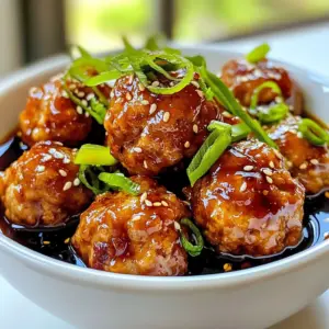 - 1 pound ground chicken - 1/2 cup breadcrumbs - 1/4 cup green onions, finely chopped - 1 egg, lightly beaten - 2 cloves garlic, minced - 1 teaspoon ginger, grated - 1 tablespoon soy sauce - Salt and pepper to taste - 1 tablespoon sesame oil To make these meatballs, I use ground chicken. It gives a nice texture and flavor. Breadcrumbs help bind everything together. I add green onions for a fresh taste. The egg helps hold the meatballs firm. Minced garlic adds a strong aroma. Grated ginger gives a hint of spice. Soy sauce adds saltiness and depth. Salt and pepper enhance all the flavors. Sesame oil adds a nutty touch. - 1/2 cup soy sauce - 1/4 cup honey - 1/4 cup rice vinegar - 2 tablespoons cornstarch - 1/4 cup water - 1 teaspoon sesame seeds (for garnish) - Sliced green onions (for garnish) For the teriyaki sauce, I use soy sauce as the base. Honey gives sweetness and richness. Rice vinegar adds a slight tang. Cornstarch thickens the sauce for a glossy finish. Water helps mix everything well. I garnish with sesame seeds for crunch. Sliced green onions add color and flavor on top. {{ingredient_image_1}} 1. Preheating the oven: Start by preheating your oven to 400°F (200°C). This helps cook the meatballs evenly and makes them golden brown. 2. Mixing meatball ingredients: In a large bowl, combine the ground chicken, breadcrumbs, and chopped green onions. Add the beaten egg, minced garlic, grated ginger, soy sauce, and a pinch of salt and pepper. Mix well until everything is combined. 3. Forming meatballs and placing on a baking sheet: Shape the mixture into small meatballs, about 1 inch wide. Place them on a baking sheet lined with parchment paper. This keeps them from sticking and makes cleanup easy. 1. Baking meatballs: Drizzle the meatballs with sesame oil for extra flavor. Bake them in the oven for 18 to 20 minutes, or until they are fully cooked. You want them to be golden brown and juicy. 2. Preparing teriyaki sauce: While the meatballs bake, make the teriyaki sauce. In a small saucepan, mix soy sauce, honey, rice vinegar, cornstarch, and water. Cook over medium heat. Stir constantly until it thickens and simmers. Once thick, remove it from heat. 3. Coating meatballs with sauce: When the meatballs are done, place them in a large bowl. Drizzle the teriyaki sauce over them and toss gently to coat each meatball. This adds a sweet and savory glaze that makes them delicious. To make great meatballs, start with proper mixing. Combine your ground chicken, breadcrumbs, green onions, egg, garlic, ginger, soy sauce, salt, and pepper. Use your hands to mix gently. Don’t overwork the mixture; it can make the meatballs tough. For cooking time, bake at 400°F (200°C) for 18-20 minutes. This will give you juicy meatballs. Check them with a meat thermometer. They should reach 165°F (75°C) to be safe to eat. The outside should be golden brown for the best texture. To boost the teriyaki sauce flavor, you can adjust the honey. If you like it sweeter, add more honey. For a tangy twist, try adding a splash of lime juice. You can mix in some red pepper flakes for heat. To make your sauce thicker, use cornstarch as you heat it. Mix it with water first to avoid lumps. Stir it into the sauce until it thickens. This trick helps you achieve that glossy, sticky texture we all love. Pro Tips Use Fresh Ingredients: Fresh garlic and ginger will elevate the flavor of your meatballs, giving them a more vibrant taste. Adjust Sweetness: Feel free to modify the amount of honey in the teriyaki sauce based on your preference for sweetness. Make Ahead: You can prepare the meatballs in advance and freeze them. Just bake them straight from the freezer, adding a few extra minutes to the cooking time. Experiment with Protein: This recipe works well with ground turkey, beef, or even plant-based meat alternatives for a different twist. {{image_2}} You can switch the ground chicken for ground turkey or beef. Each meat brings its own flavor. Ground turkey is leaner, making it a healthier choice. If you choose beef, you can enjoy a richer taste. Just remember, adjust the cooking time based on the meat you use. For a vegetarian twist, use cooked lentils or black beans. Mash them up and mix with breadcrumbs, egg, and spices. This gives you a meatball that is tasty and plant-based. You can also add fresh herbs for extra flavor. To spice up your meatballs, try adding different spices or herbs. Garlic powder or onion powder can enhance the taste. Fresh cilantro or basil can add a fragrant touch. If you like heat, a pinch of red pepper flakes works wonders. You can also experiment with different sauces. Try using hoisin sauce or teriyaki sauce for a sweet flavor. For a tangy twist, you might mix in some pineapple juice. Each sauce can change the taste of your meatballs, making them fun to explore. To keep your sweet teriyaki meatballs fresh, follow these steps: - Refrigeration: Place leftover meatballs in an airtight container. They stay good in the fridge for up to three days. Make sure to store them with some sauce to keep them moist. - Freezing: For longer storage, freeze the meatballs. Lay them in a single layer on a baking sheet, then freeze until solid. Once frozen, transfer them to a freezer bag. They can last up to three months. You can also freeze the sauce separately. When you want to enjoy your meatballs again, reheating is key: - Microwave: Place meatballs in a microwave-safe dish. Add a bit of water or sauce to keep them moist. Cover with a lid or microwave-safe wrap. Heat in short bursts until hot. - Oven: Preheat your oven to 350°F (175°C). Place meatballs in an oven-safe dish and cover with foil. Heat for about 15 minutes or until warmed through. This method helps keep them juicy and tasty. Can I make meatballs ahead of time? Yes, you can make meatballs ahead of time. Just mix the meatball ingredients and shape them. Place the raw meatballs on a baking sheet, then cover them with plastic wrap. You can freeze them for up to three months. When you're ready, bake them straight from the freezer. This saves time on busy days. Where can I buy pre-made sweet teriyaki meatballs? You can find pre-made sweet teriyaki meatballs at most grocery stores. Check the frozen food aisle, as many brands offer them. You can also look in the deli section. These are great for a quick meal, but homemade meatballs taste fresher and are easy to make. What sides pair well with sweet teriyaki meatballs? Sweet teriyaki meatballs go well with many sides. Here are a few ideas: - Steamed rice - Stir-fried vegetables - Salad with sesame dressing - Noodles tossed in soy sauce These sides balance the sweet flavor and make your meal complete. Feel free to mix and match! In this post, I covered the key steps to make delicious sweet teriyaki meatballs. We discussed the main ingredients and how to perfectly prepare and cook them. I also shared tips for achieving that perfect texture and enhancing the sauce. You can experiment with different meats or flavors to suit your taste. Remember to store leftovers properly and reheat them so they stay juicy. Enjoy creating your own tasty versions of these meatballs!